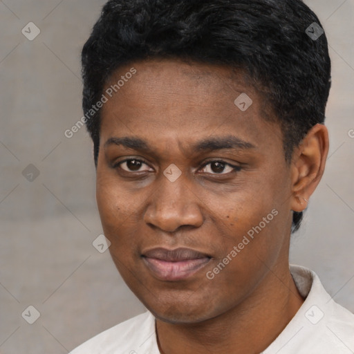 Joyful black young-adult male with short  black hair and brown eyes