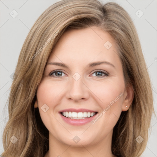 Joyful white young-adult female with long  brown hair and green eyes