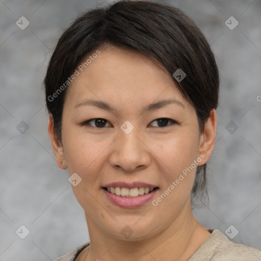 Joyful asian adult female with short  brown hair and brown eyes