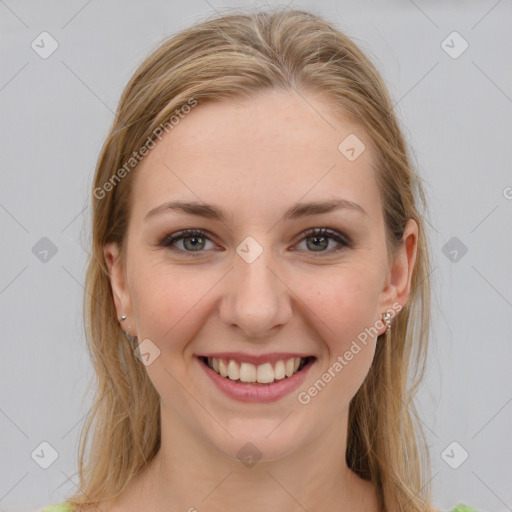 Joyful white young-adult female with long  brown hair and grey eyes