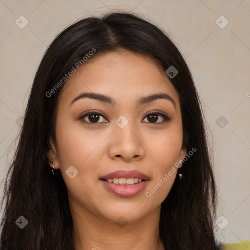 Joyful latino young-adult female with long  brown hair and brown eyes