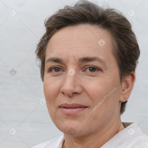 Joyful white adult female with short  brown hair and brown eyes