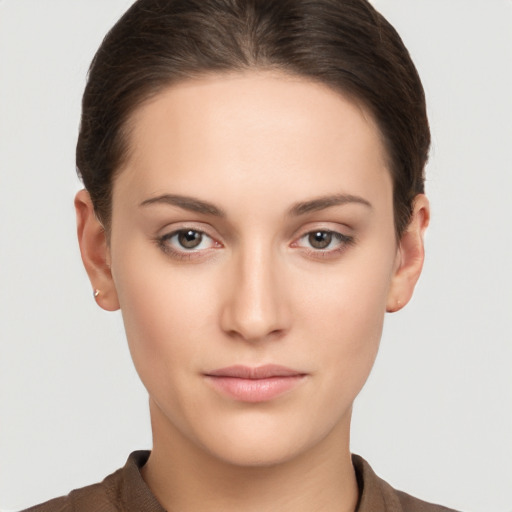 Neutral white young-adult female with short  brown hair and brown eyes