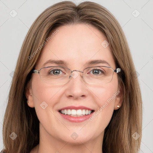 Joyful white adult female with long  brown hair and green eyes