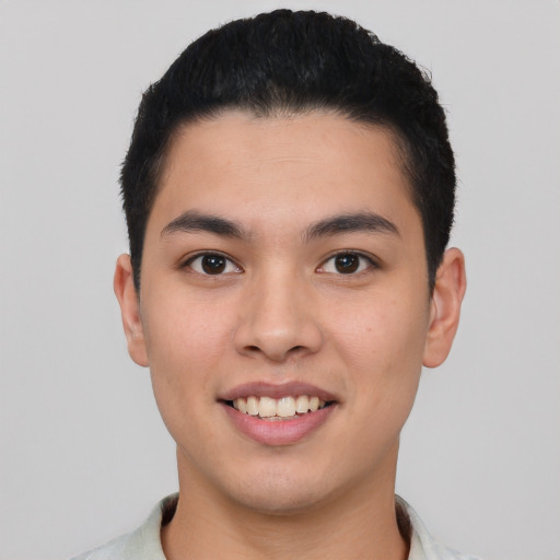 Joyful asian young-adult male with short  black hair and brown eyes