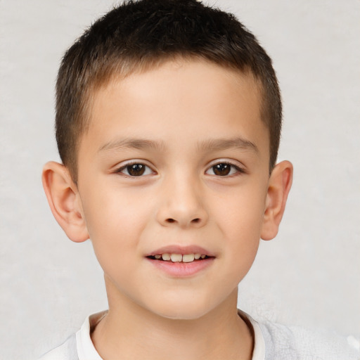 Joyful white child male with short  brown hair and brown eyes