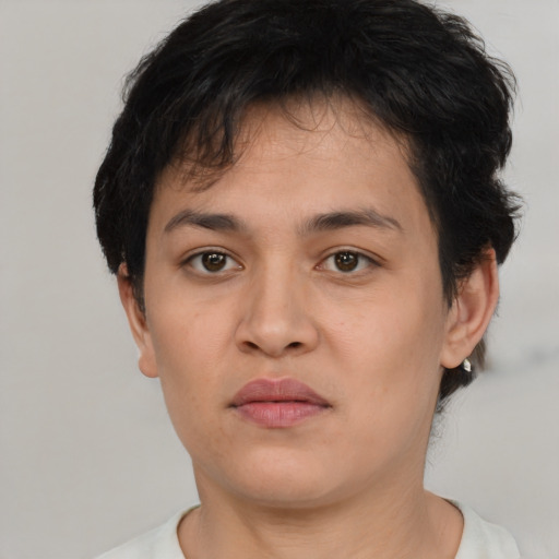 Joyful asian young-adult female with short  brown hair and brown eyes