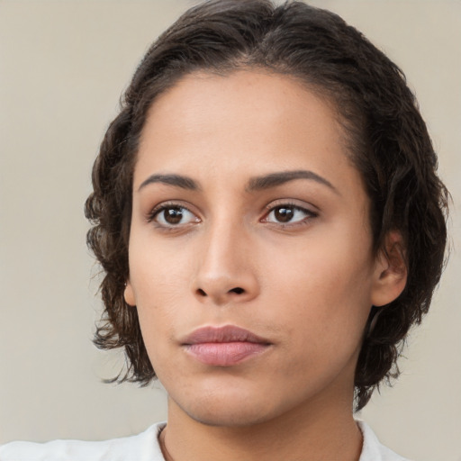 Neutral latino young-adult female with medium  brown hair and brown eyes