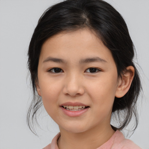 Joyful asian child female with medium  brown hair and brown eyes