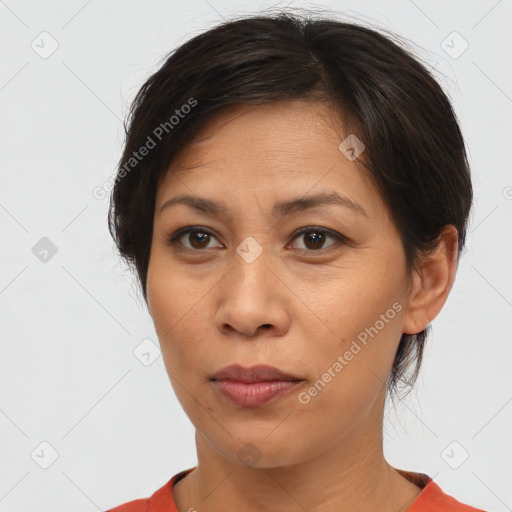 Neutral asian adult female with short  brown hair and brown eyes