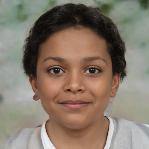 Joyful latino child female with short  brown hair and brown eyes