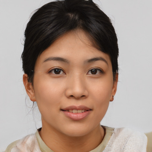 Joyful asian young-adult female with medium  brown hair and brown eyes