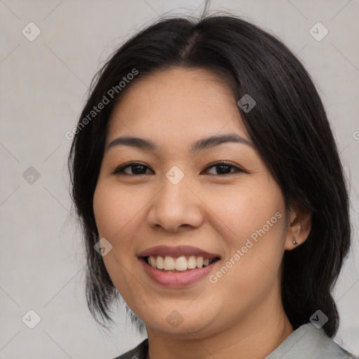 Joyful asian young-adult female with medium  black hair and brown eyes