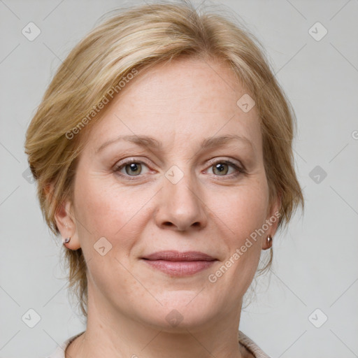 Joyful white adult female with medium  brown hair and blue eyes