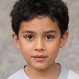 Joyful white child male with short  brown hair and brown eyes