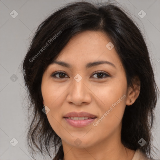 Joyful latino young-adult female with medium  brown hair and brown eyes