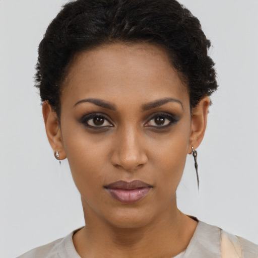 Neutral black young-adult female with short  brown hair and brown eyes