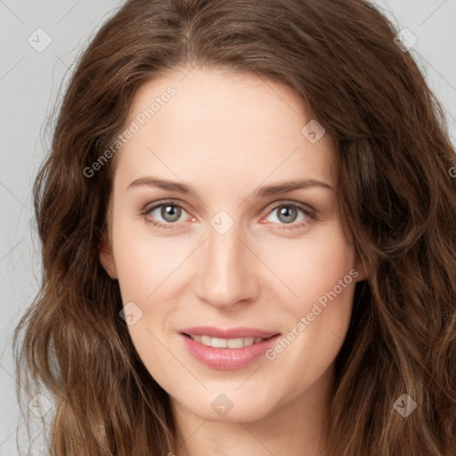 Joyful white young-adult female with long  brown hair and green eyes