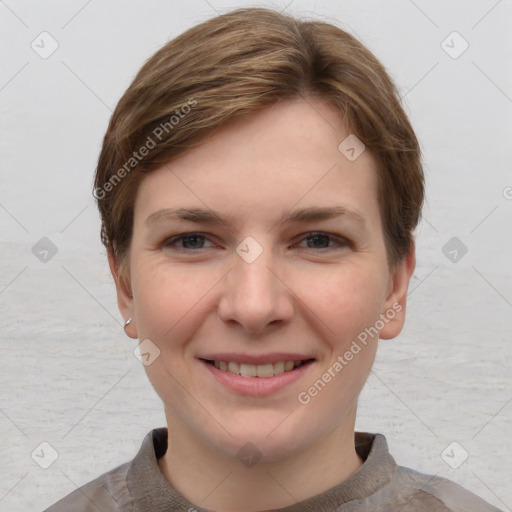 Joyful white young-adult female with short  brown hair and grey eyes