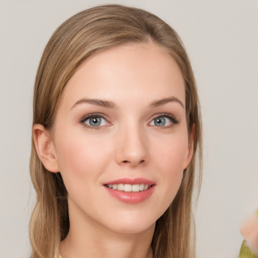 Joyful white young-adult female with long  brown hair and grey eyes