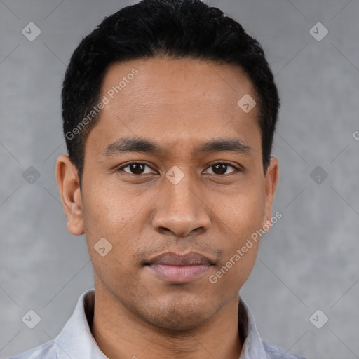 Joyful latino young-adult male with short  black hair and brown eyes