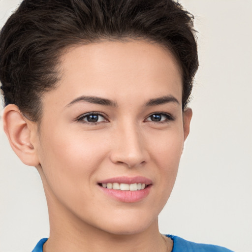 Joyful white young-adult female with short  brown hair and brown eyes