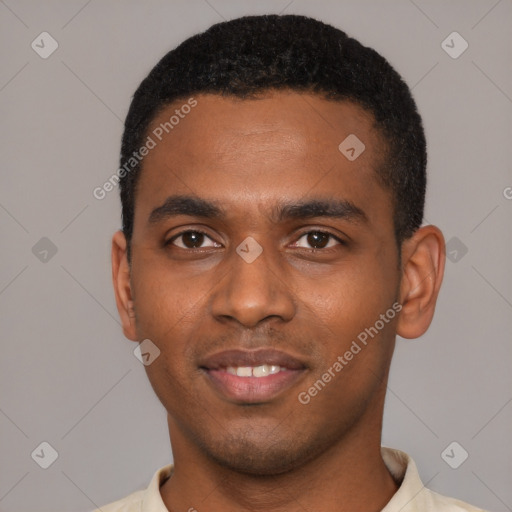 Joyful black young-adult male with short  black hair and brown eyes