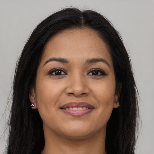 Joyful asian young-adult female with long  brown hair and brown eyes