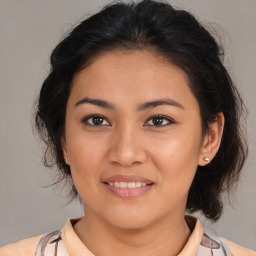 Joyful white young-adult female with medium  brown hair and brown eyes