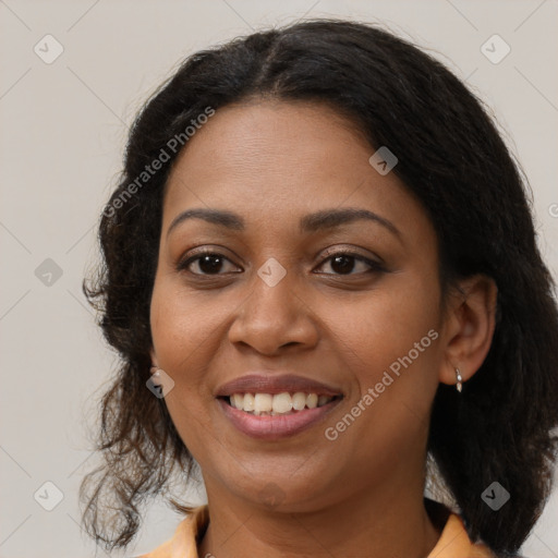 Joyful black young-adult female with medium  brown hair and brown eyes