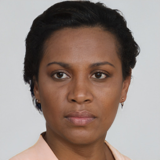 Neutral black young-adult female with short  brown hair and brown eyes