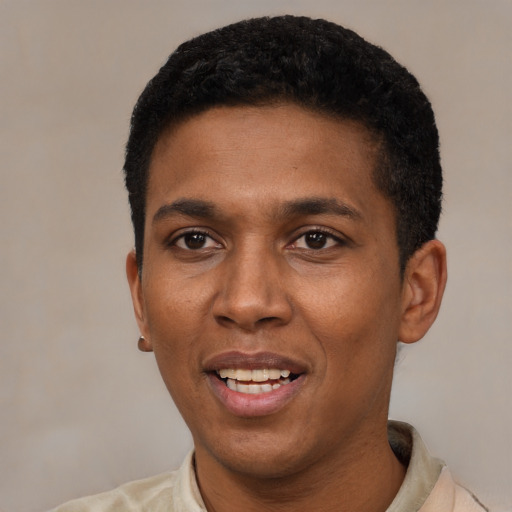 Joyful black young-adult male with short  black hair and brown eyes