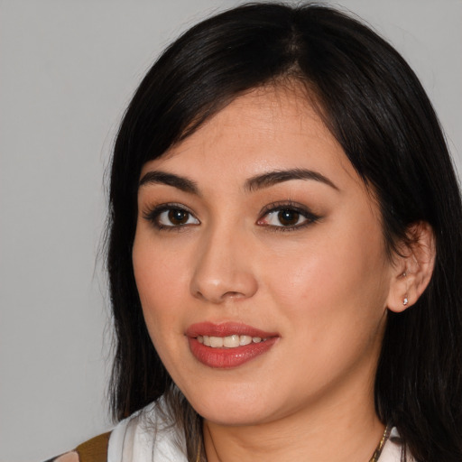 Joyful white young-adult female with long  black hair and brown eyes