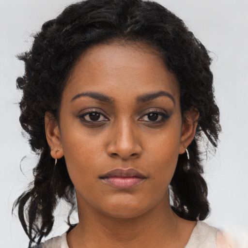 Neutral black young-adult female with long  black hair and brown eyes