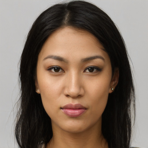Neutral latino young-adult female with long  brown hair and brown eyes