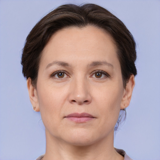 Joyful white adult female with short  brown hair and brown eyes