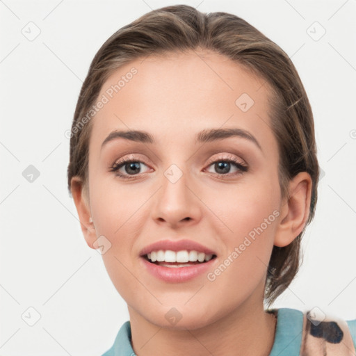 Joyful white young-adult female with medium  brown hair and grey eyes