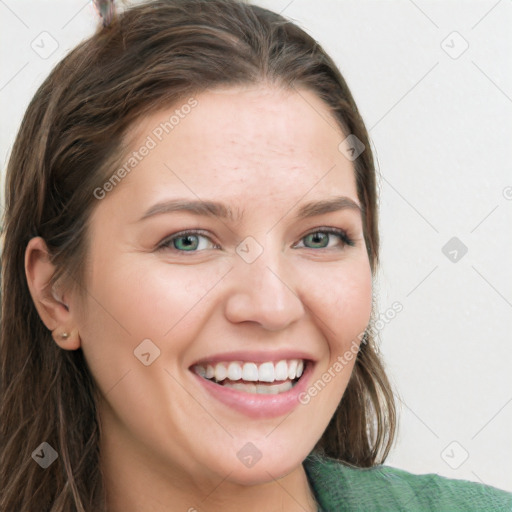 Joyful white young-adult female with long  brown hair and green eyes