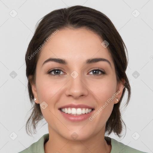 Joyful white young-adult female with medium  brown hair and brown eyes