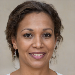 Joyful white adult female with medium  brown hair and brown eyes