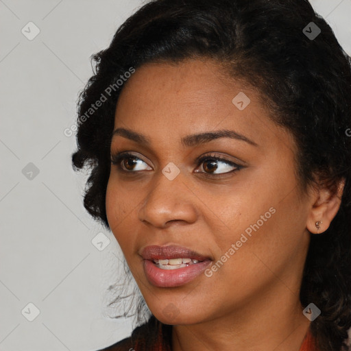 Joyful black young-adult female with medium  black hair and brown eyes