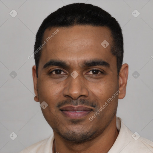 Joyful black young-adult male with short  black hair and brown eyes