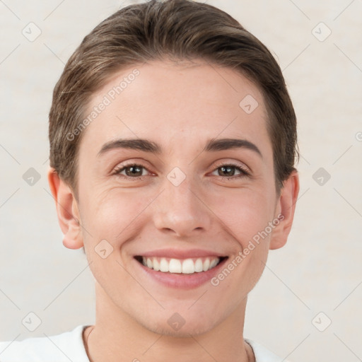 Joyful white young-adult female with short  brown hair and grey eyes