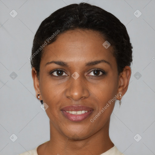 Joyful black young-adult female with short  black hair and brown eyes