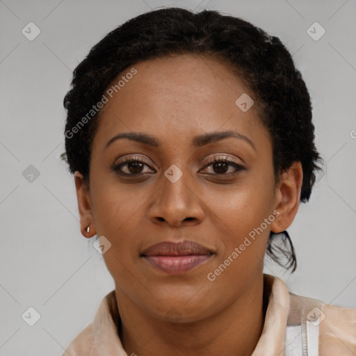 Joyful black young-adult female with short  brown hair and brown eyes