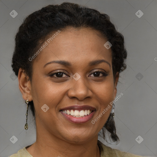 Joyful black adult female with short  brown hair and brown eyes