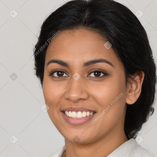 Joyful latino young-adult female with long  brown hair and brown eyes