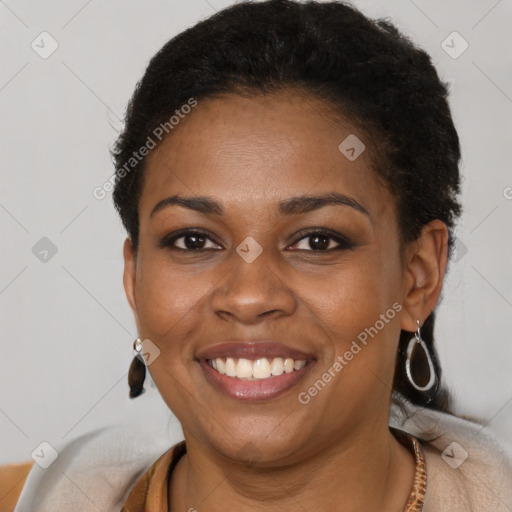 Joyful latino young-adult female with short  brown hair and brown eyes