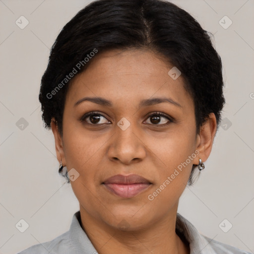 Joyful black adult female with short  brown hair and brown eyes