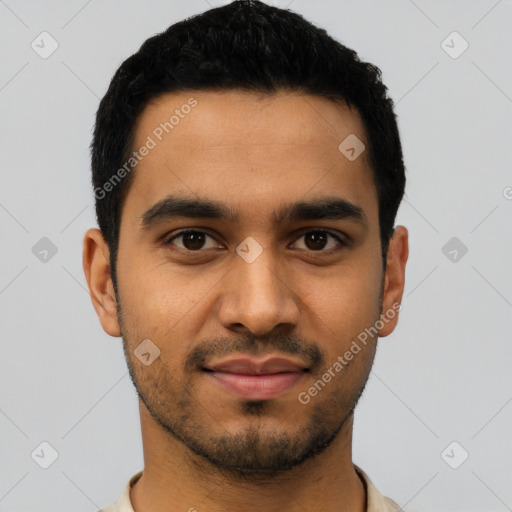Joyful latino young-adult male with short  black hair and brown eyes